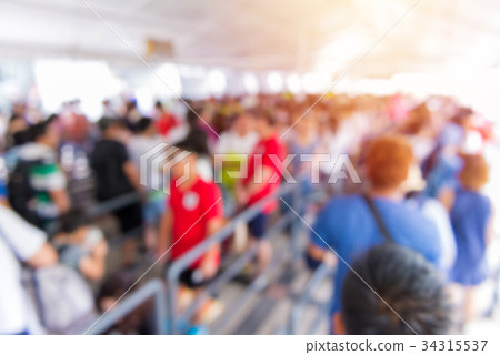 blur people at queue in front of exhibition gate 34315537