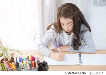 Portrait of asian cute girl doing your homework  at home 34320474