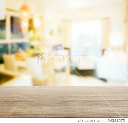 wooden table top with blur of modern dining room wooden table top with blur of modern dining room 34321075