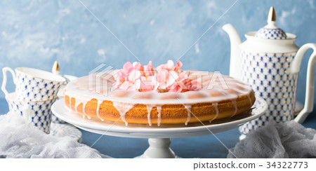 Bundt cake with frosting. Festive treat banner Bundt cake with frosting. Festive treat banner 34322773