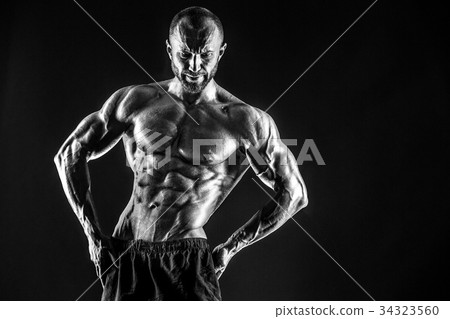 Strong bald bodybuilder with six pack. Strong bald bodybuilder with six pack. 34323560