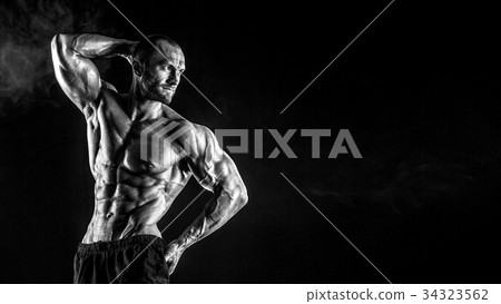 Strong bodybuilder man with perfect abs, shoulders Strong bodybuilder man with perfect abs, shoulders 34323562