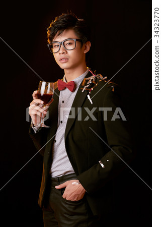Enjoying wine at the party Enjoying wine at the party 34323770