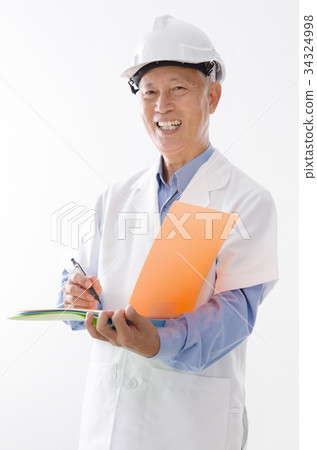 Asian old engineer writing Asian old engineer writing 34324998