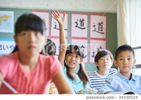 Elementary school class classroom raising hands 34330524