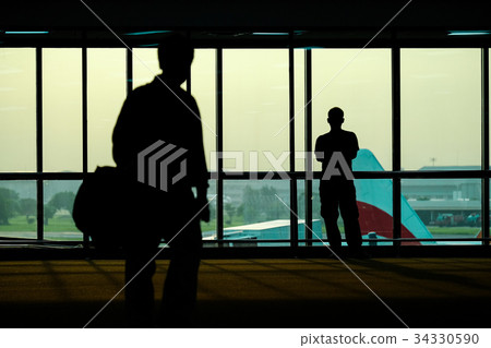 Silhouette of people in the airport Silhouette of people in the airport 34330590