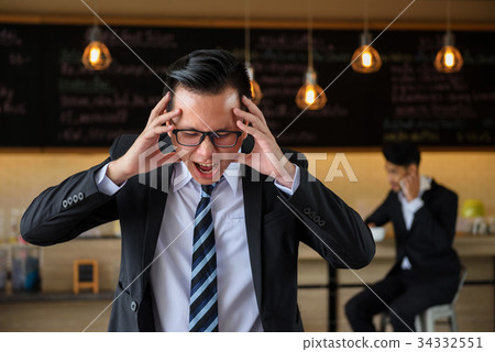 Asian angry and stress businessman screaming 34332551