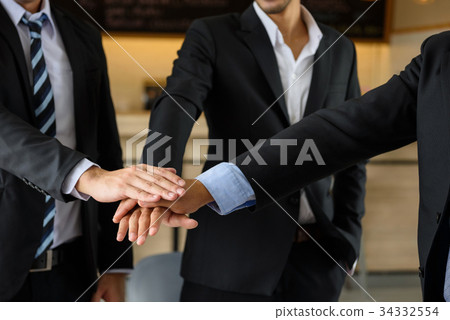 businessman team touching hands, teamwork 34332554