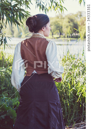 A woman runs along the swamp 34333381