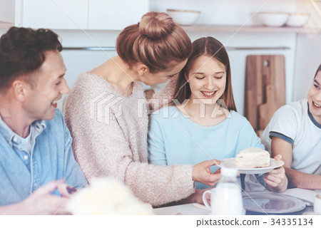 Mindful mother entertaining family with sweetest 34335134
