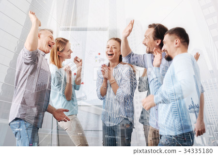 Cheerful colleagues celebrating a successful 34335180