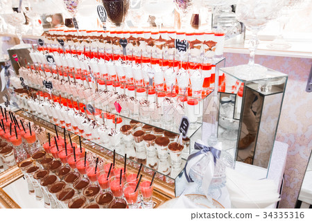 Delicious sweets on wedding candy buffet with Delicious sweets on wedding candy buffet with 34335316