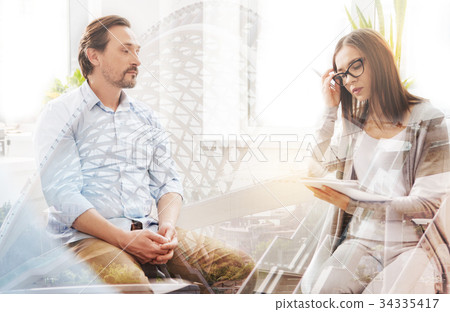 Professional psychologist having an individual Professional psychologist having an individual 34335417