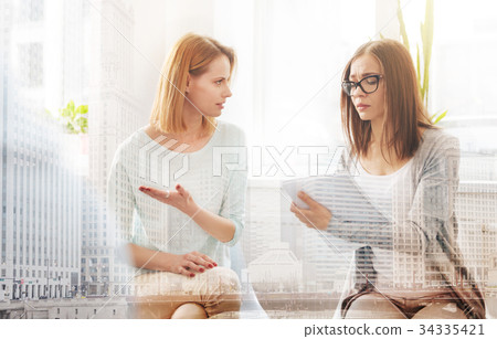Professional helpful psychologist talking with a Professional helpful psychologist talking with a 34335421