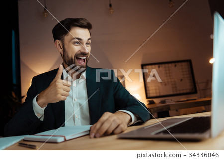 Cheerful man feeling happiness while being in Cheerful man feeling happiness while being in 34336046