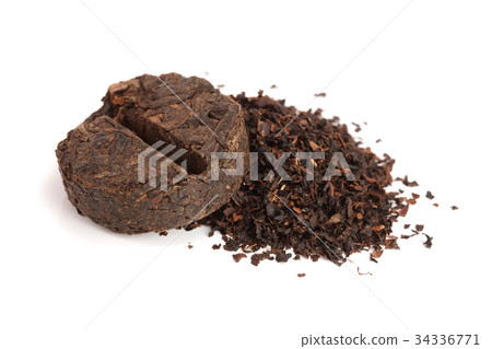 Round flat disc of puer tea isolated on white Round flat disc of puer tea isolated on white 34336771