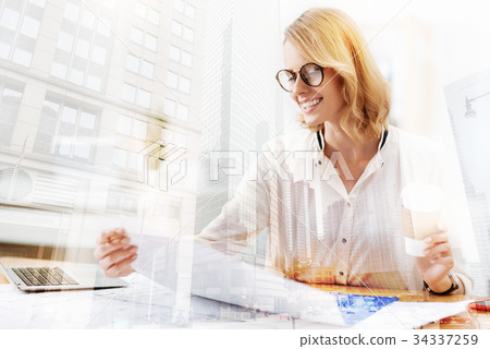 Busy worker holding papers in the hand 34337259