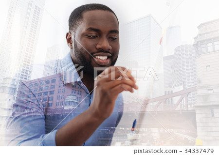 Close up of African American using a pen Close up of African American using a pen 34337479