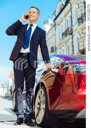 Smart nice businessman discussing work on the 34338076