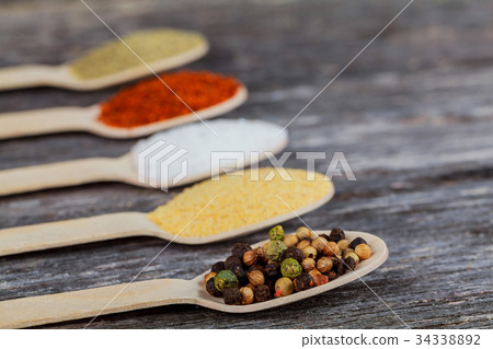 Spices and herbs on old kitchen table. 34338892