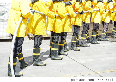 Firefighters using water for fighter fire Firefighters using water for fighter fire 34343541