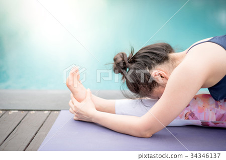 Young Asian woman doing yoga exercise 34346137
