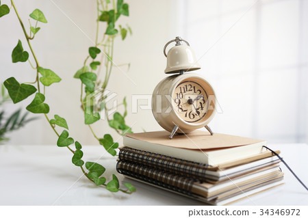 Alarm clock and notebook 34346972