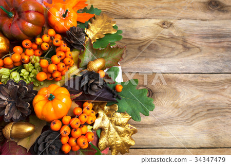 Fall arrangement with pumpkins and berries 34347479