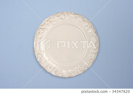 Elegant plate and blue cloth Elegant plate and blue cloth 34347820