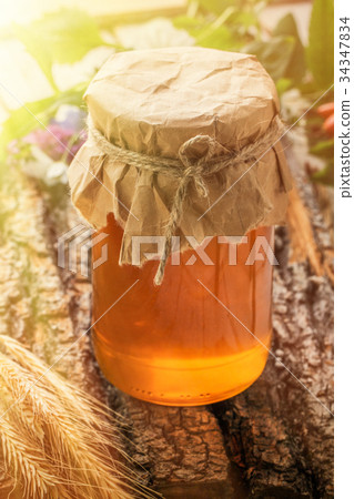 The bowl with honey on wooden table. toned photo The bowl with honey on wooden table. toned photo 34347834