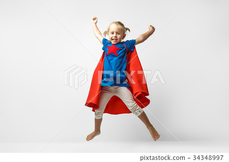 Very excited little girl dressed like superhero Very excited little girl dressed like superhero 34348997