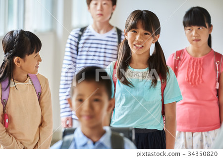Elementary school attendance at school corridor 34350820