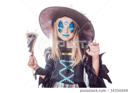 Girl in a witch costume isolated on white Girl in a witch costume isolated on white 34350849