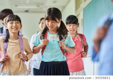 Elementary school attendance at school corridor Elementary school attendance at school corridor 34350851