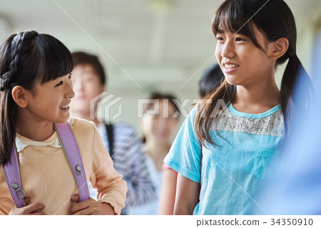 Elementary school attendance at school corridor 34350910