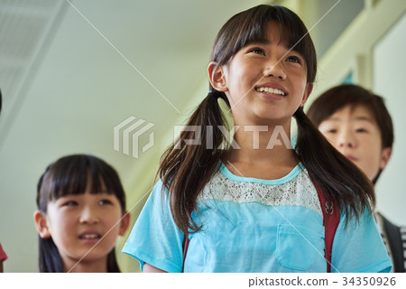 Elementary school attendance at school corridor 34350926