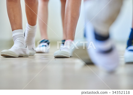 Elementary school attendance at school corridor 34352118