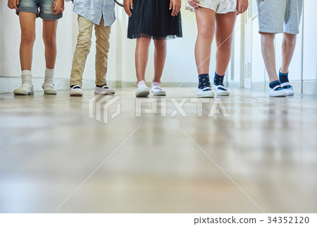 Elementary school attendance at school corridor 34352120