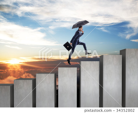 Young businessman climbs up on staircase. 34352802