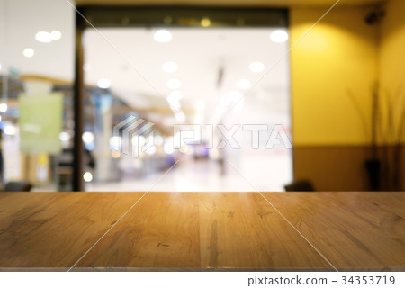 Empty dark wooden table blurred background 34353719