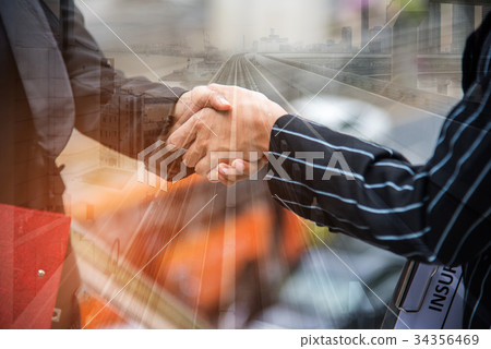 Two business women hand shake at outdoors Two business women hand shake at outdoors 34356469