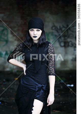 woman on a background of an ruined building woman on a background of an ruined building 34356836