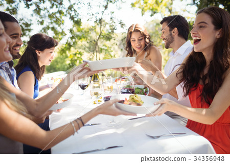 Group of friends having lunch Group of friends having lunch 34356948