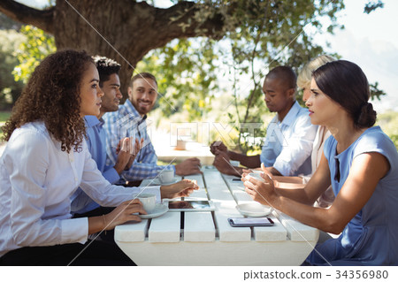 Group of friends interacting with each other 34356980