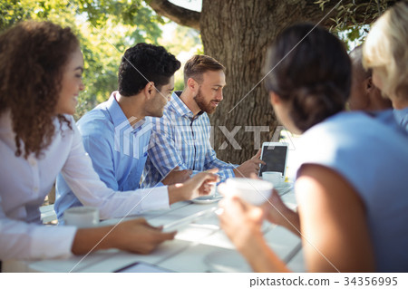 Group of friends interacting with each other 34356995