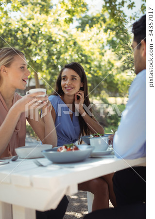 Group of friends having lunch Group of friends having lunch 34357017