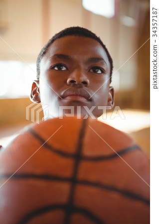Thoughtful teenage basketball player 34357187
