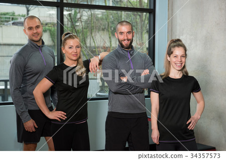 Portrait of friends standing together at gym Portrait of friends standing together at gym 34357573