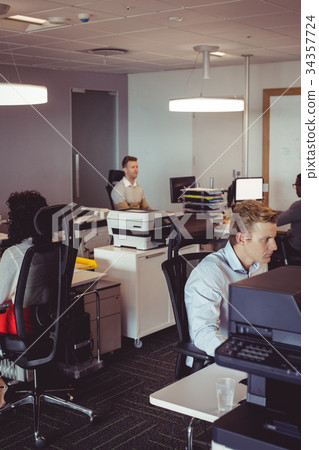 Business colleagues working at modern office 34357724