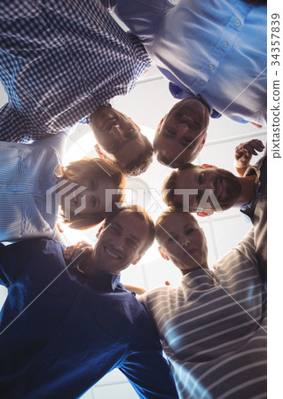 Directly below portrait of business colleagues huddling 34357839